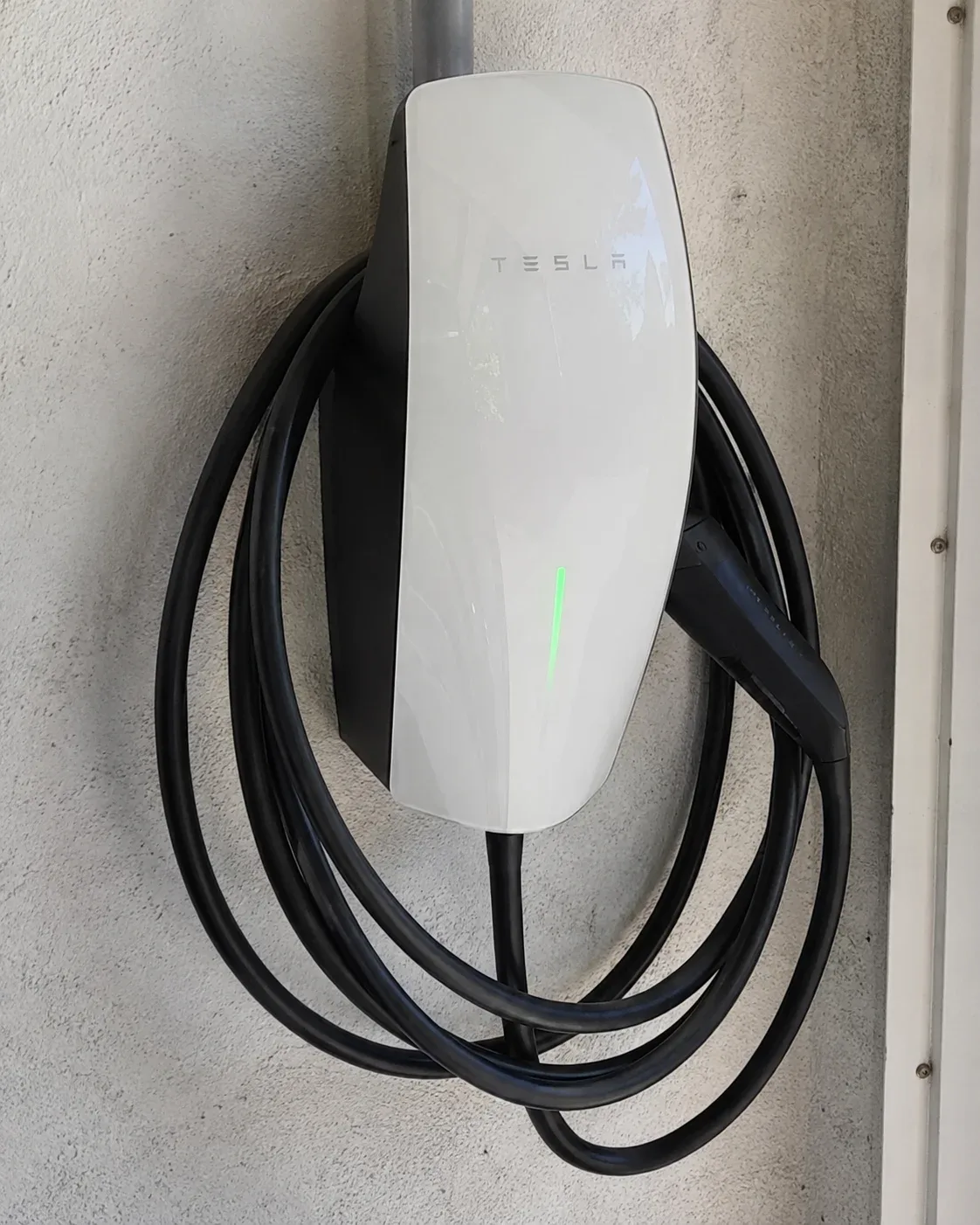 Tesla Wall Connector EV charger installed in a Whitby garage